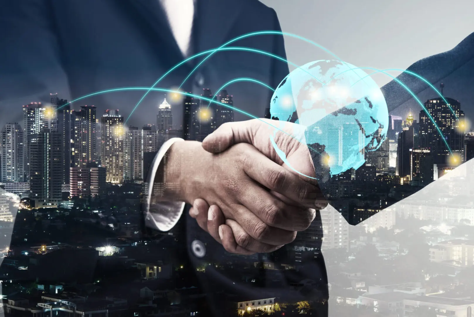 double exposure of businessmen handshake and global simulation connecting technology with blur city night and network connection, successful and partnership concept